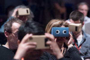 funny looking VR boxes tried on by lab attendants